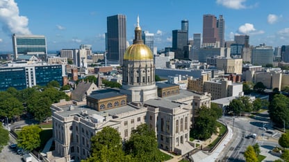 The gold dome of the Georgia Capitol gleams in the sun, Aug. 27, 2022.