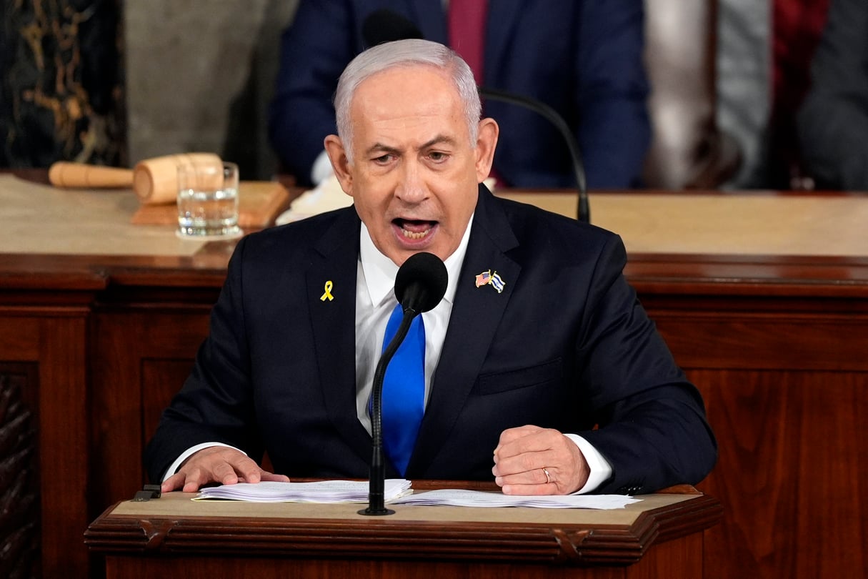 Israeli Prime Minister Benjamin Netanyahu speaks fervently with his fist on the podium at a joint meeting of Congress at the Capitol.