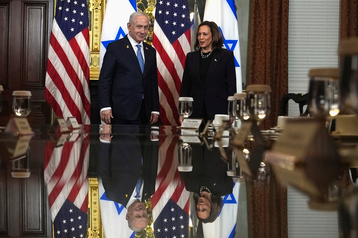 Vice President Kamala Harris, right, and Israeli Prime Minister Benjamin Netanyahu appear before a meeting at the Eisenhower Executive Office Building on the White House complex in Washington, Thursday, July 25, 2024. American and Israeli flags are behind them.