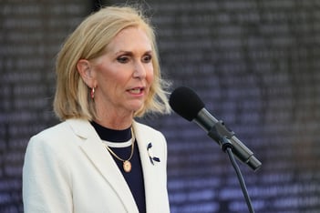 Mississippi Attorney General Lynn Fitch speaks into a microphone at the Mississippi Fallen Officers Candlelight Vigil at the Capitol Complex in Jackson, Miss.