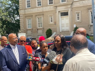 Tabatha Colzie, the mother of a 29-year-old woman who was shot in the head at a block party in Mechanicsville, speaks at a press conference outside Grady Memorial Hospital.