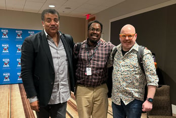 Shot in the Arm executive producer Neil deGrasse Tyson, left, poses with All Things Considered producer Christopher Alston, center, and host Jim Burress.