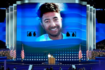 Hersh Goldberg-Polin, an Israeli American held hostage by Hamas, is pictured on screen at the Democratic National Convention.