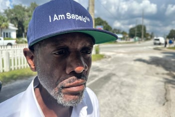 A resident of Sapelo Island wears a hat that reads I am Sapelo.
