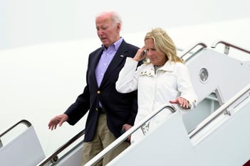 Joe and Jill Biden descend the stairs from Air Force One.