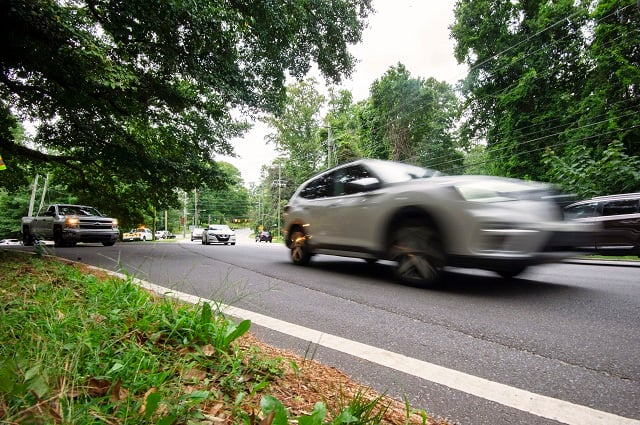 A car speeding by on a road.