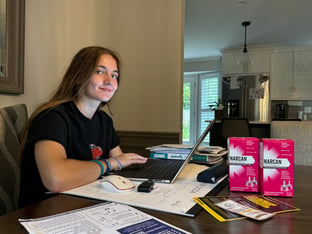 Mady Cohen sits in her parents home to work on getting Narcan in every classroom at her school.