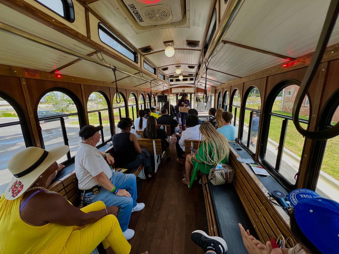 Residents ride the trolley