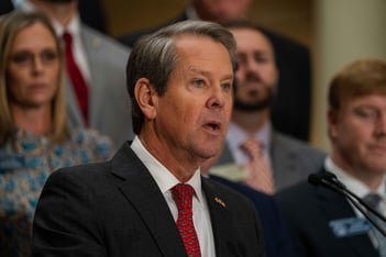 Georgia Gov. Brian Kemp, flanked by Republican lawmakers, speaks Monday, Dec. 4, 2023, at the Georgia Capitol in Atlanta.