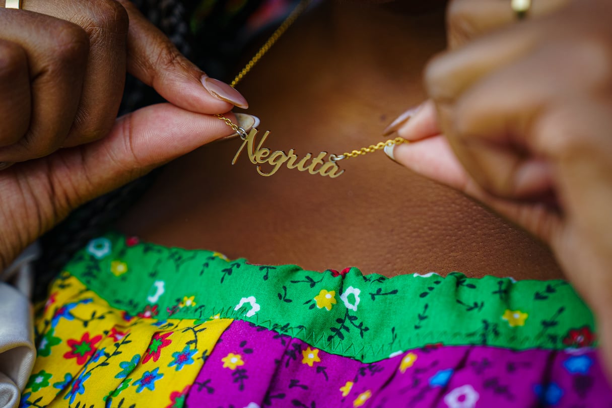 Des Bishop wearing her jewelry, which celebrates Afro Latina culture