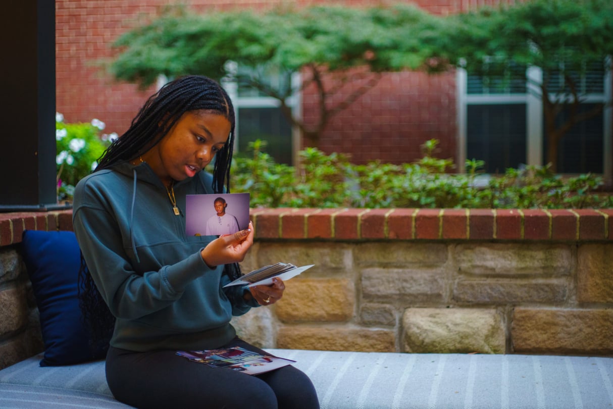 Marina Melendez looks at a photo of her father, both of whom are Afro Latino