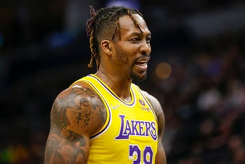 Los Angeles Lakers center Dwight Howard looks on during an NBA basketball game.