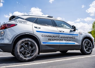 A white police car in the day.