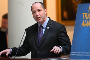 Georgia Attorney General Chris Carr speaks at a podium.