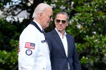 Joe Biden and Hunter Biden walk side by side.