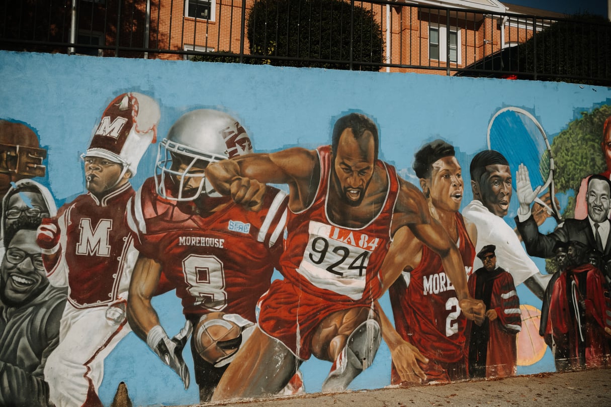 A mural depicting athletes and others on Morehouse College's campus.