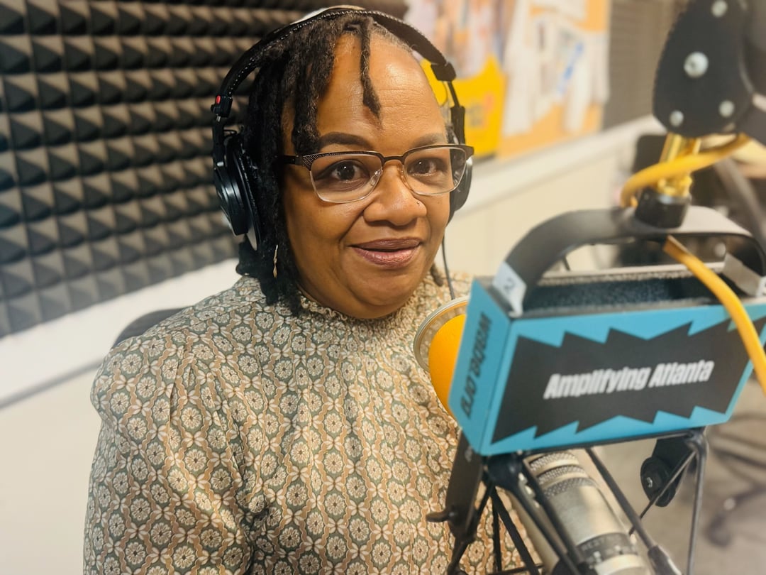 Shari Jackson sits in the WABE studio.