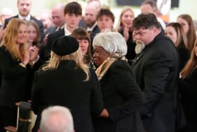 Amy Carter greets Mary Prince during the funeral service for former President Jimmy Carter at Maranatha Baptist Church.