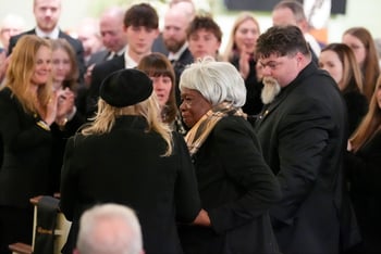 Amy Carter greets Mary Prince during the funeral service for former President Jimmy Carter at Maranatha Baptist Church.