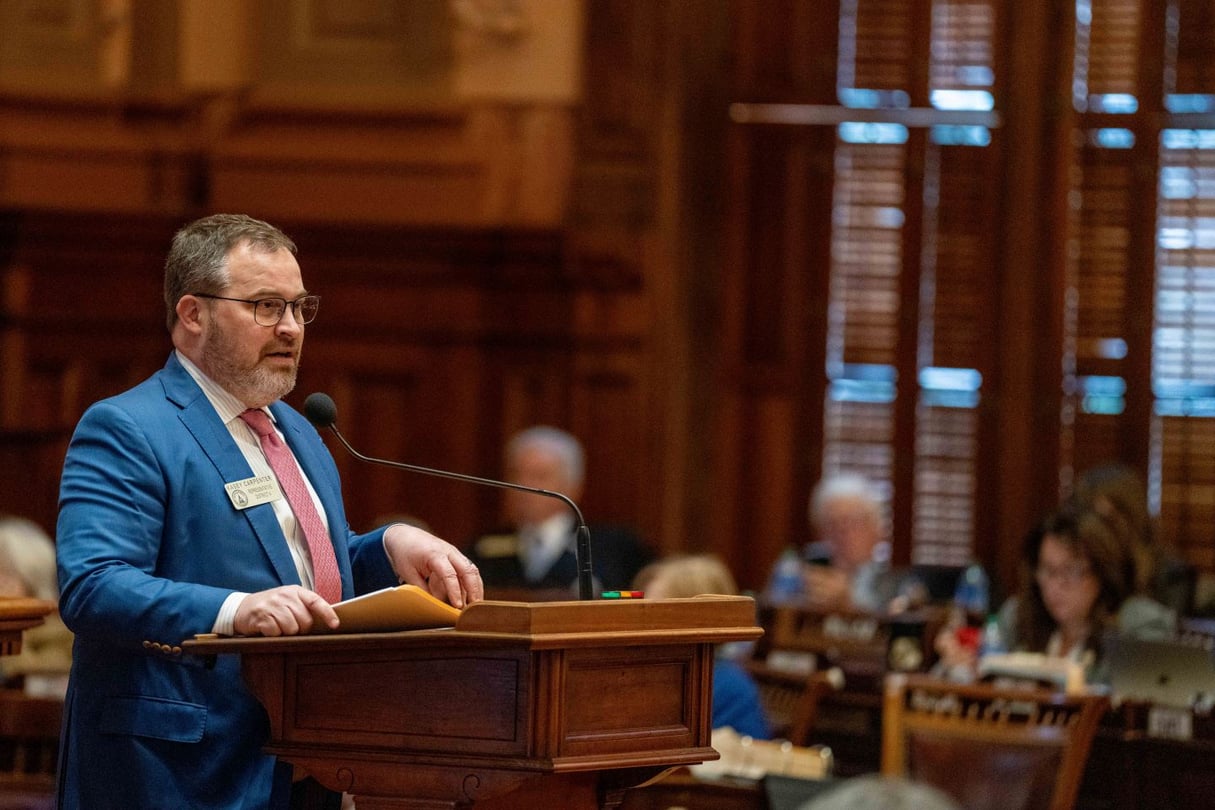 Kasey Carpenter stands at the podium in the House chamber