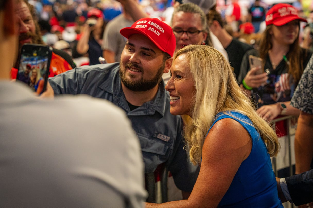 U.S. House Rep. Marjorie Taylor Greene takes a selfie with a supporter at a rally for former President Donald Trump on Aug. 3, 2024.