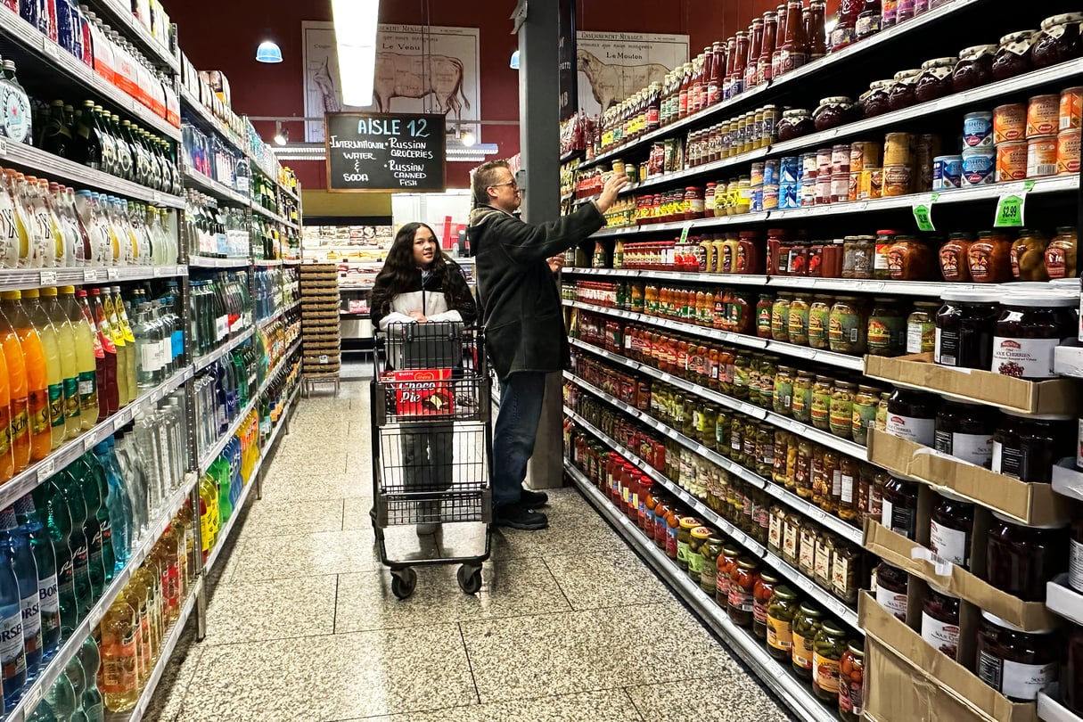 A shopper in a grocery aisle.
