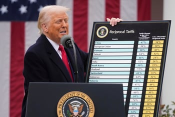 President Donald Trump held up a list of tariffs