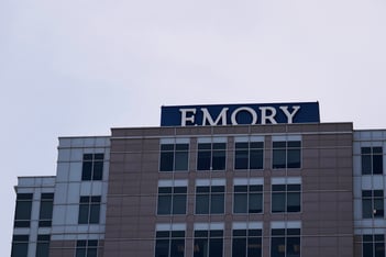 The top of an Emory hospital building with Emory's name on top.