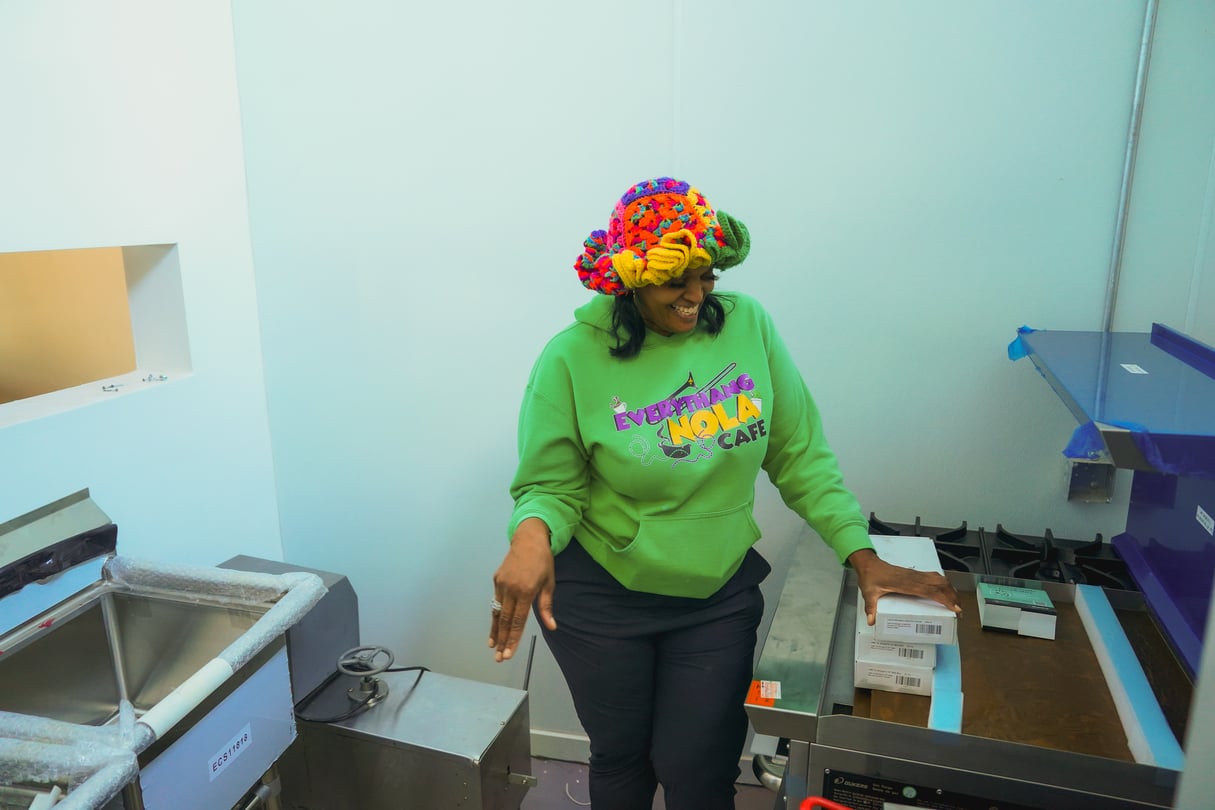 A woman standing in a kitchen.