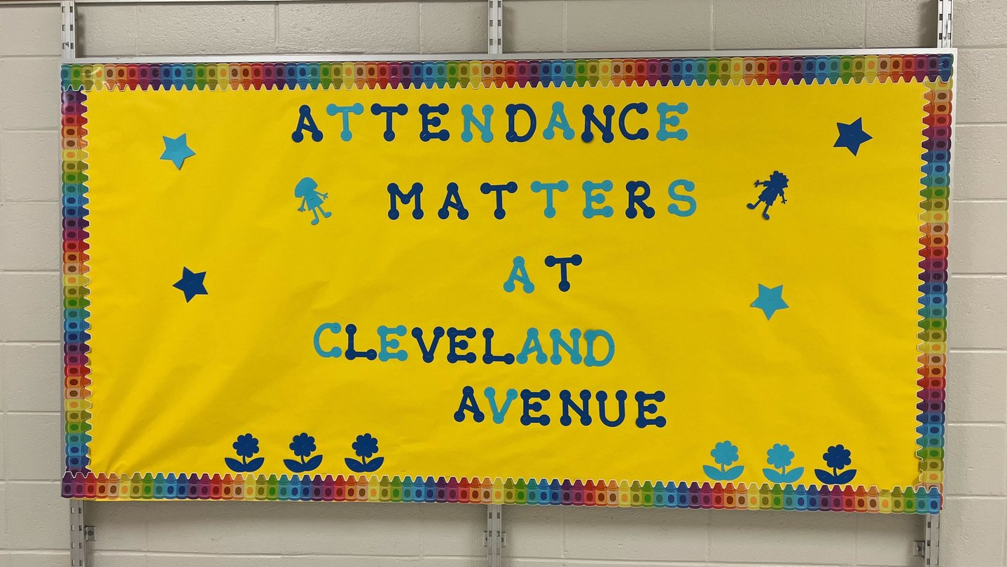 A yellow bulletin board that says Attendance Matters at Cleveland Avenue in blue letters.