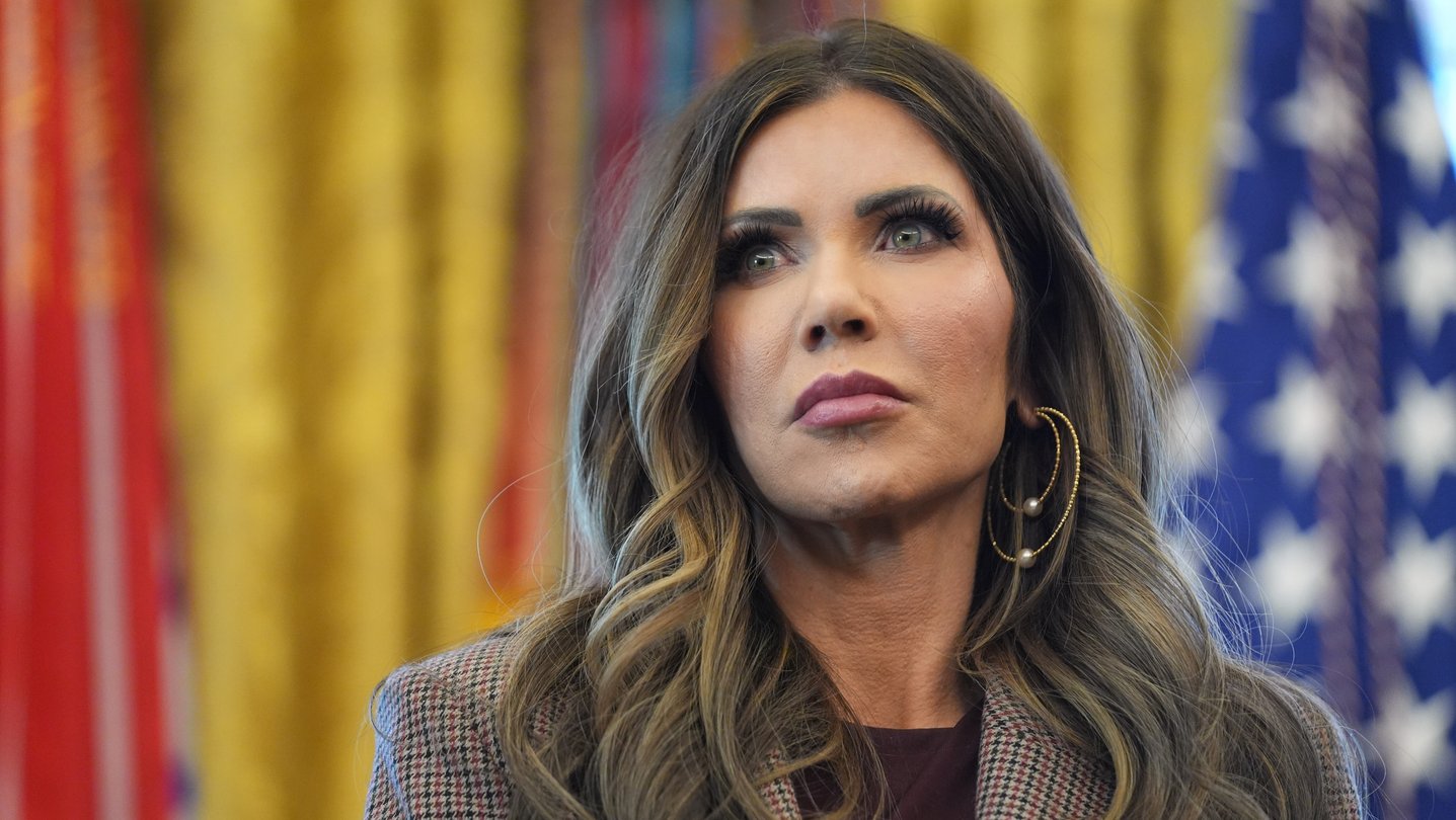 Kristi Noem stands in the Oval Office