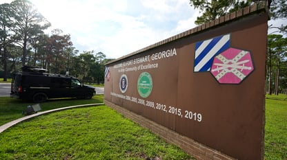 A brown sign for Fort Stewart