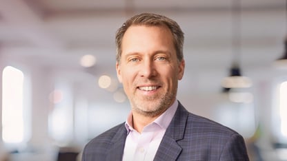Douglas Shipman smiling in a professional headshot