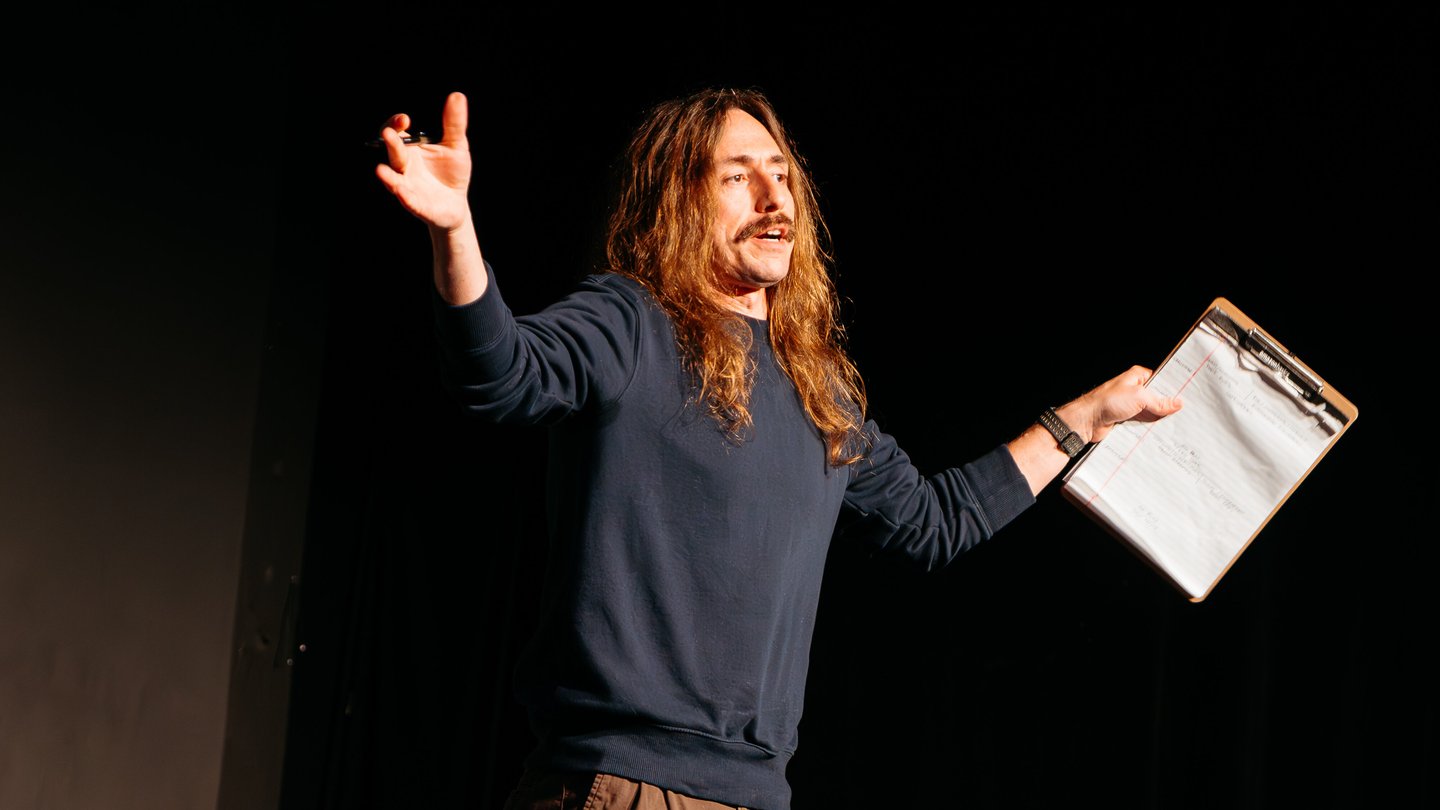Ronnie Johnson-Lopez performing solo on stage