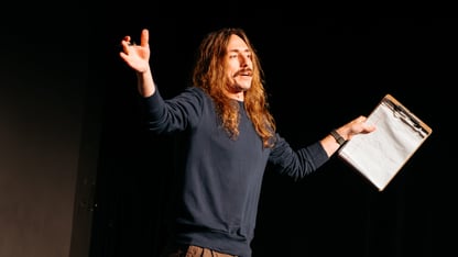 Ronnie Johnson-Lopez performing solo on stage