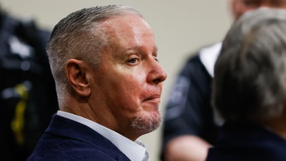 A side profile of Colin Gray as he sits in court.