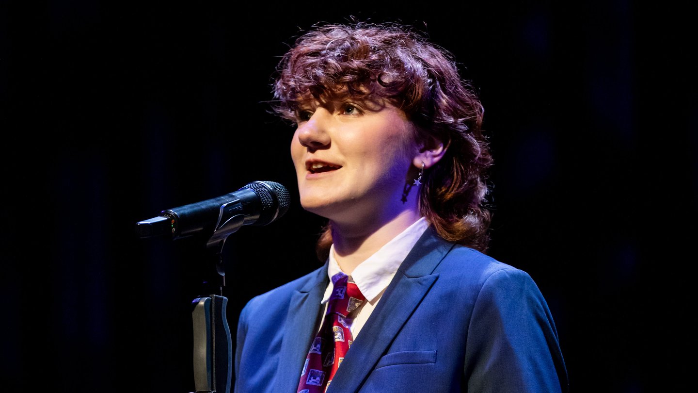 Rory Berg performing at the 2026 Poetry Out Loud Georgia contest at the Woodruff Arts Center