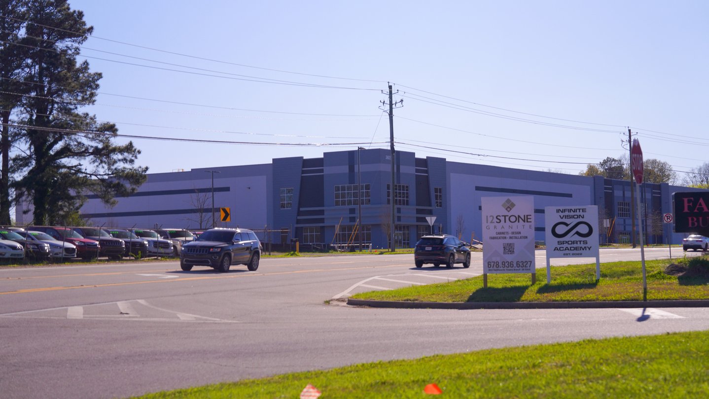 A large warehouse on a street