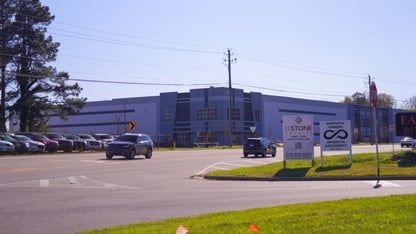A large warehouse on a street
