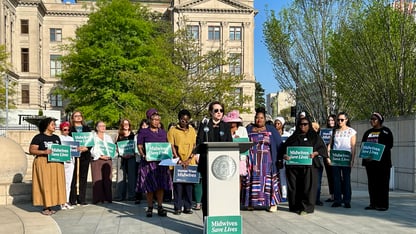 A group of Georgia midwives and reproductive health care advocates announced the lawsuit outside the state Capitol on the last day of the legislative session (JESS MADOR/WABE)