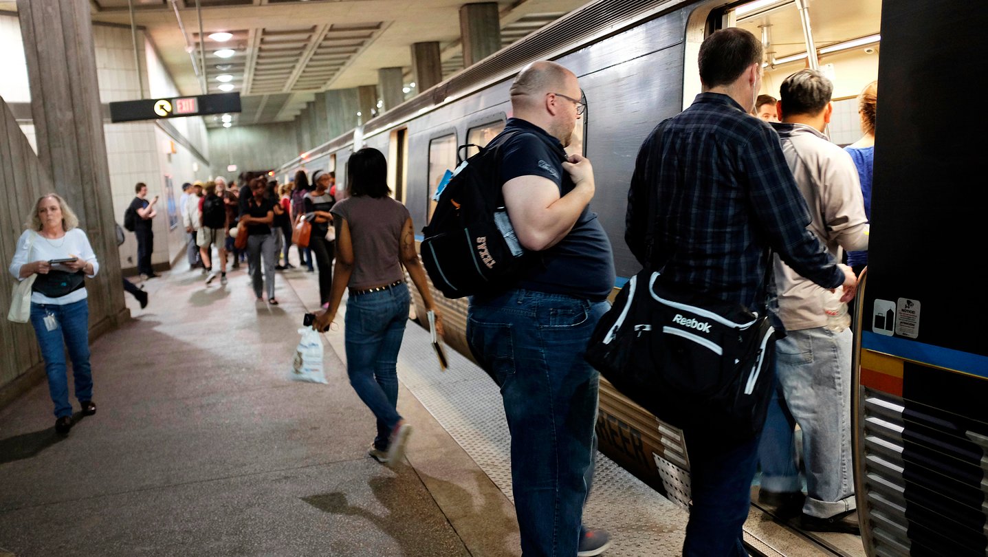 Passengers board a MARTA train during end of workday hours.