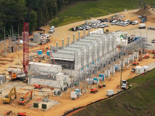 An overhead view of a power plant in the middle of construction