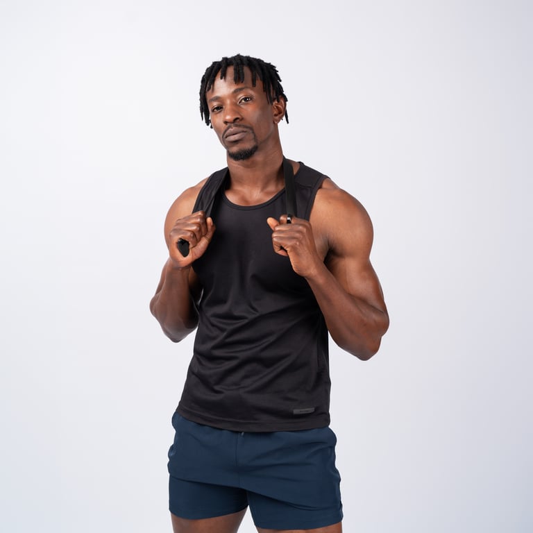 A coach in a training vest staring straight at you