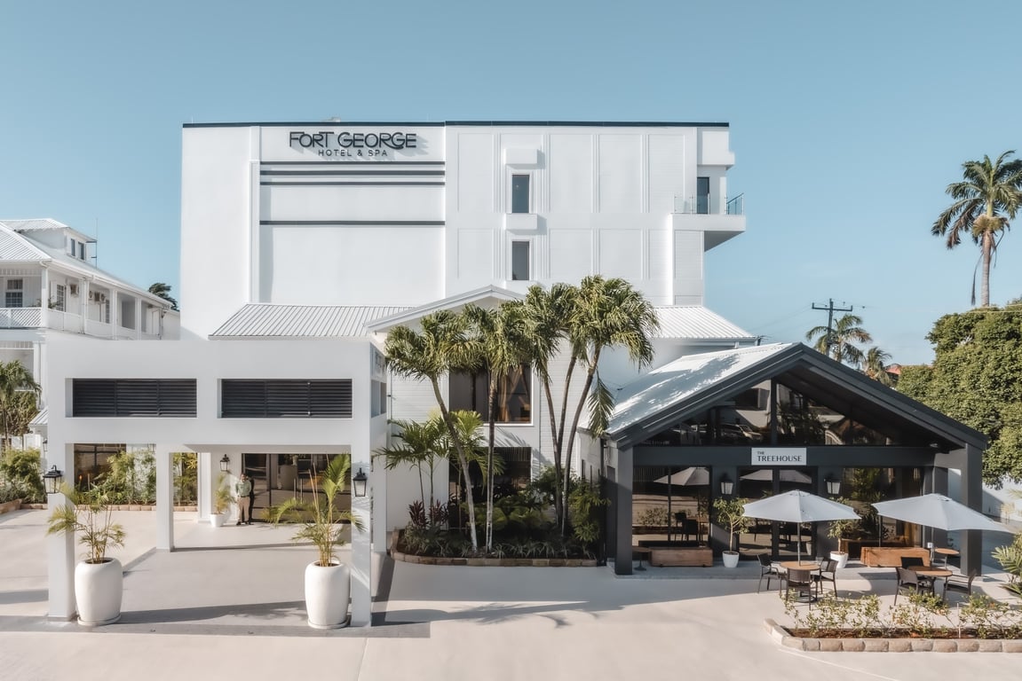 This Historic Resort & Spa Is an Idyllic Escape from Belize’s Largest City | Fort George Belize outdoor seating | Fort George Belize table and kitchen | Fort George Belize bedroom suite | Fort George Belize lobby