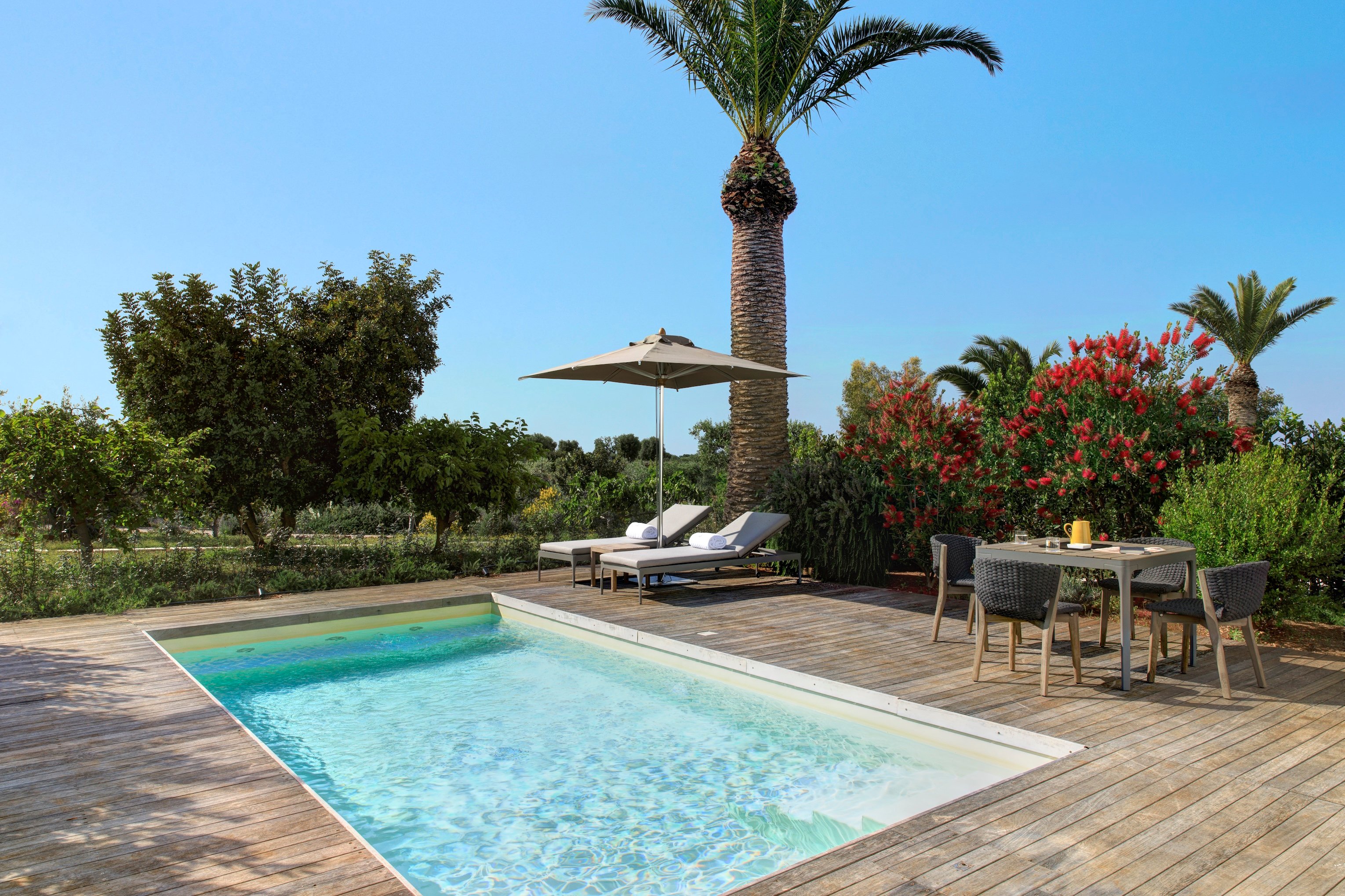 Pool and lounge at Restaurant at Masseria Torre Maizza, a Rocco Forte Hotel
