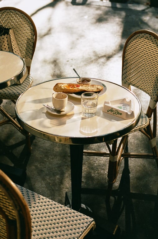 This Dreamy Café is a Mainstay of Montmartre | exterior awning of Au Rêve | Au Rêve outdoor seating | Inside the french cafe Au Rêve | Inside seating of Au Rêve | original bar Au Rêve | Au Rêve dining | Au Rêve signature dining