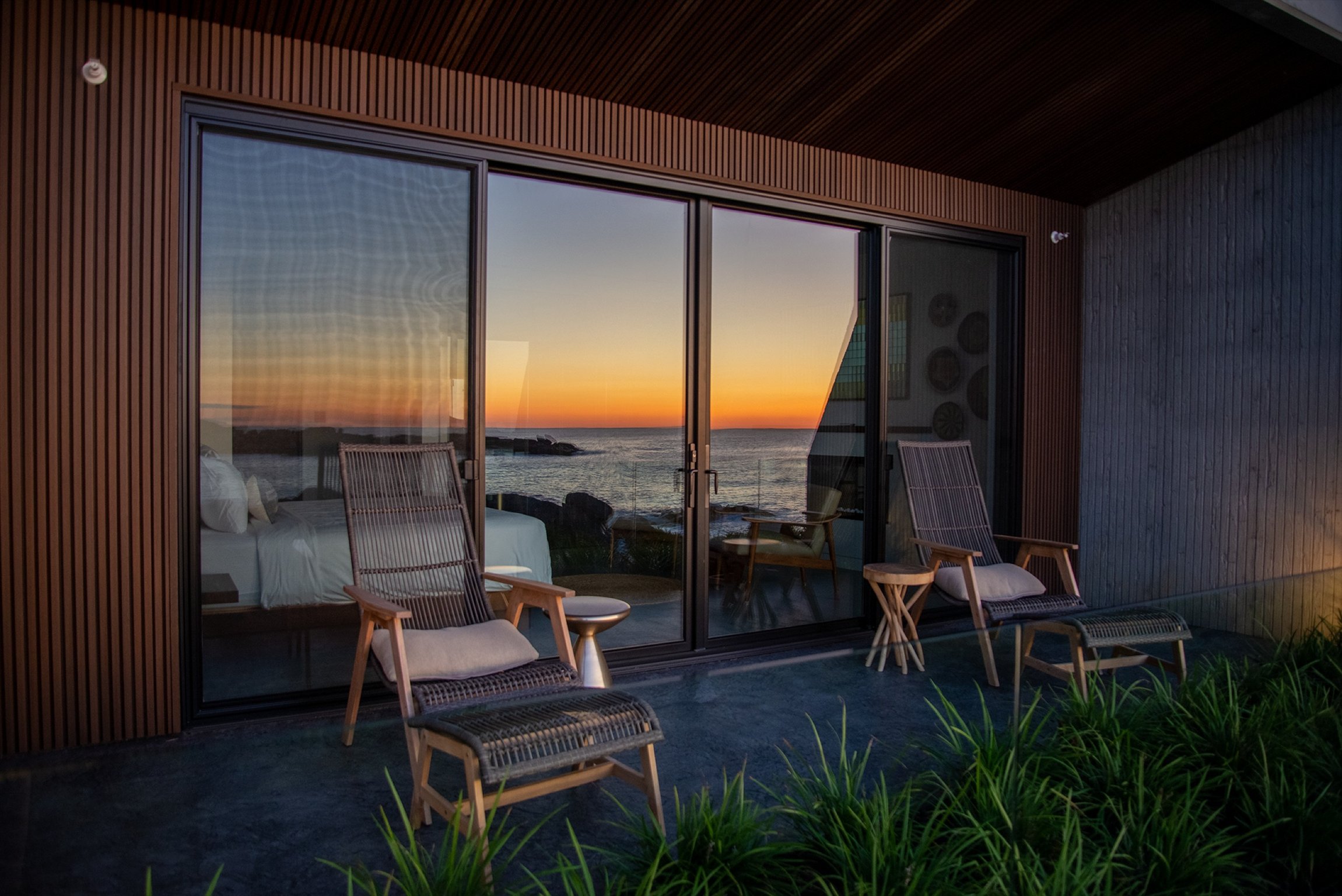 A Modern Maine Hideaway With Picture-Perfect Views | The Viewpoint hotel exterior view | The Viewpoint hotel suite bedroom | The Viewpoint hotel suite living room | The Viewpoint hotel bathroom sink | The Viewpoint hotel view