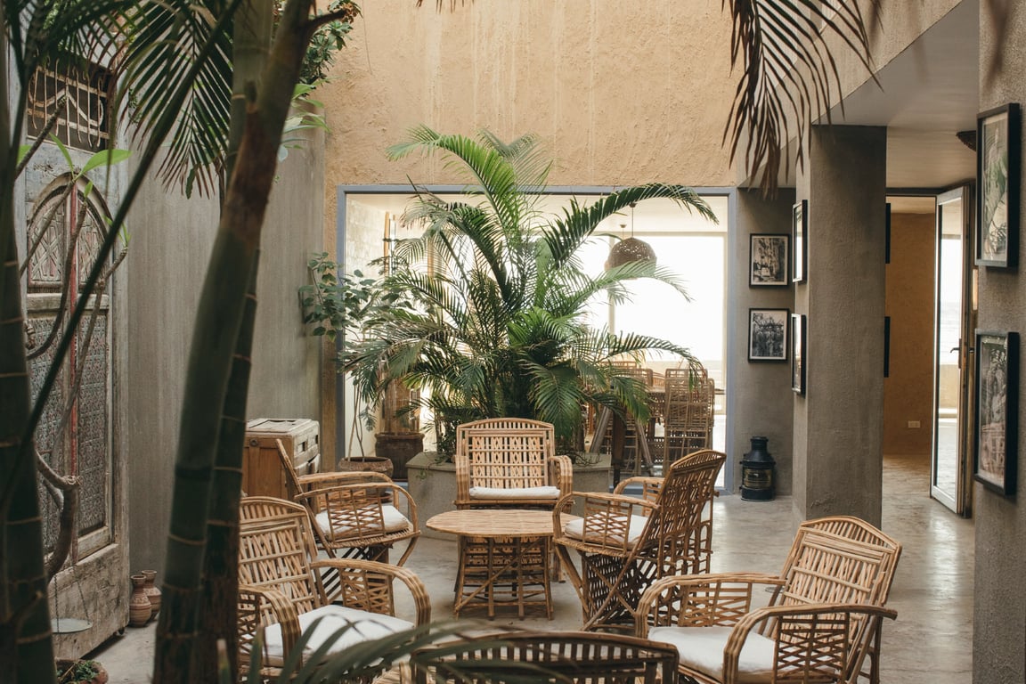 Experience the eco-chic charm of Dar Dahab, a boutique hotel on the Red Sea, blending traditional Islamic design and stunning views. | Dar Dahab exterior | Dar Dahab living room | Dar Dahab mud awning | Dar Dahab bedroom | Dar Dahab ocean