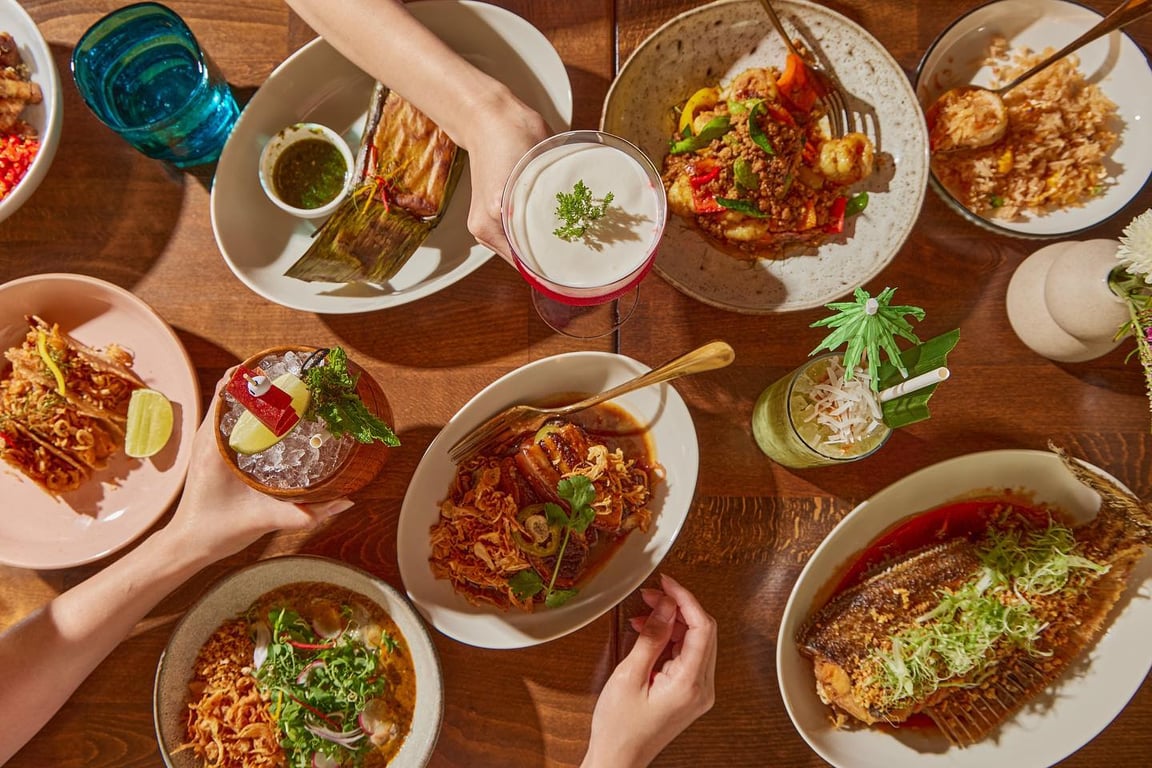This Restaurant in Hell’s Kitchen Serves Some of the Best Thai Dishes in New York City | Chalong NYC restaurant seating | Chalong NYC bar seating | Chalong NYC shrimp curry | Chalong NYC signature dish | Chalong NYC After school cocktail | Chalong NYC Better Together dessert | Chalong NYC signature cocktail spread