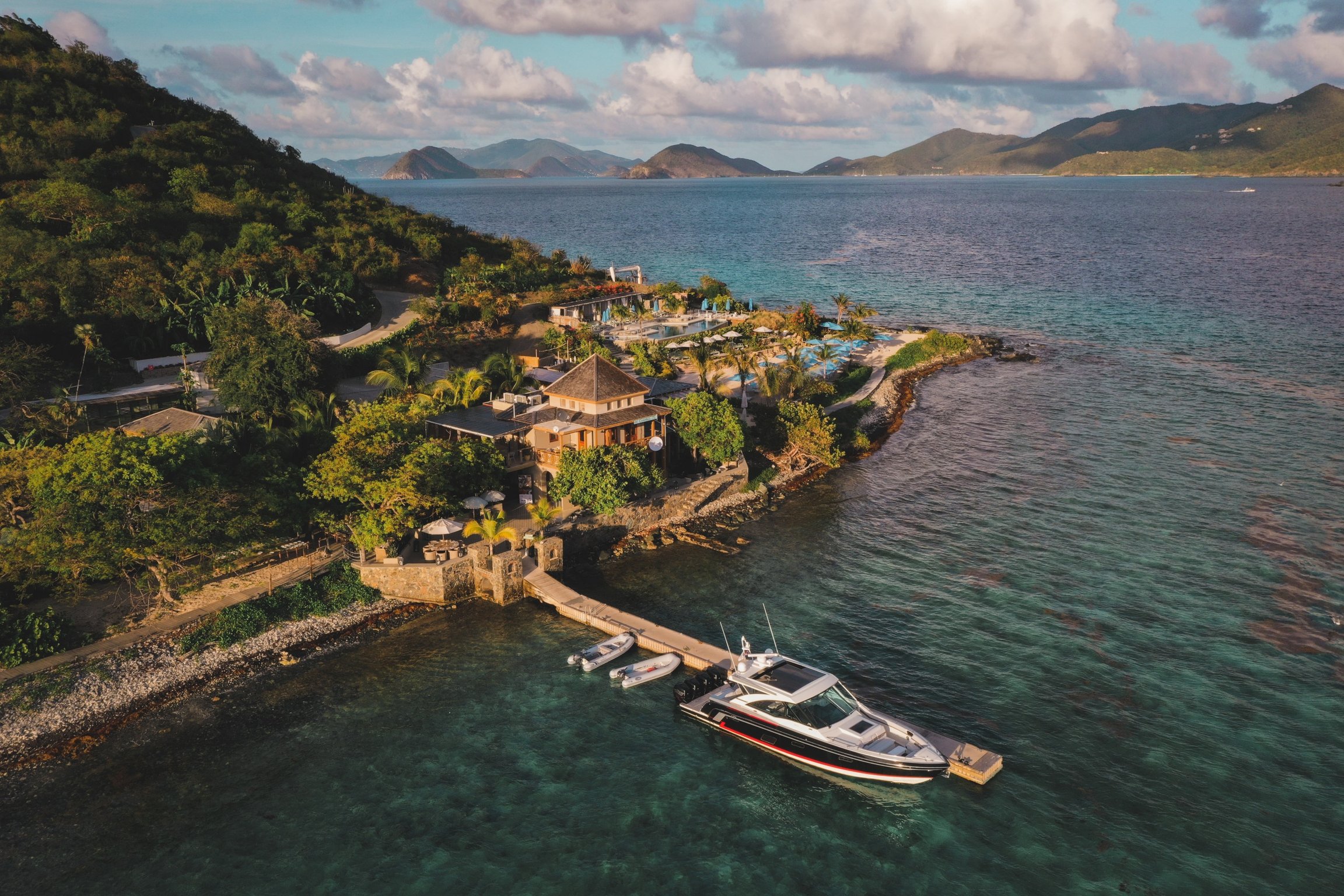 There’s No Passport Required For This Private Island Escape in the U.S. Virgin Islands | Lovango Resort & Beach Club private beach | Lovango Resort & Beach Club bedroom suite | Lovango Resort & Beach Club bedroom seating | Lovango Resort & Beach Club cabana | Lovango Resort & Beach Club suite balcony